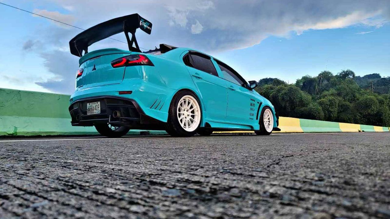 2010-2015 Mitsubishi Lancer Evolution X VARIS V2 Style Rear Bumper – Unpainted FRP Material with Aggressive Diffuser Styling