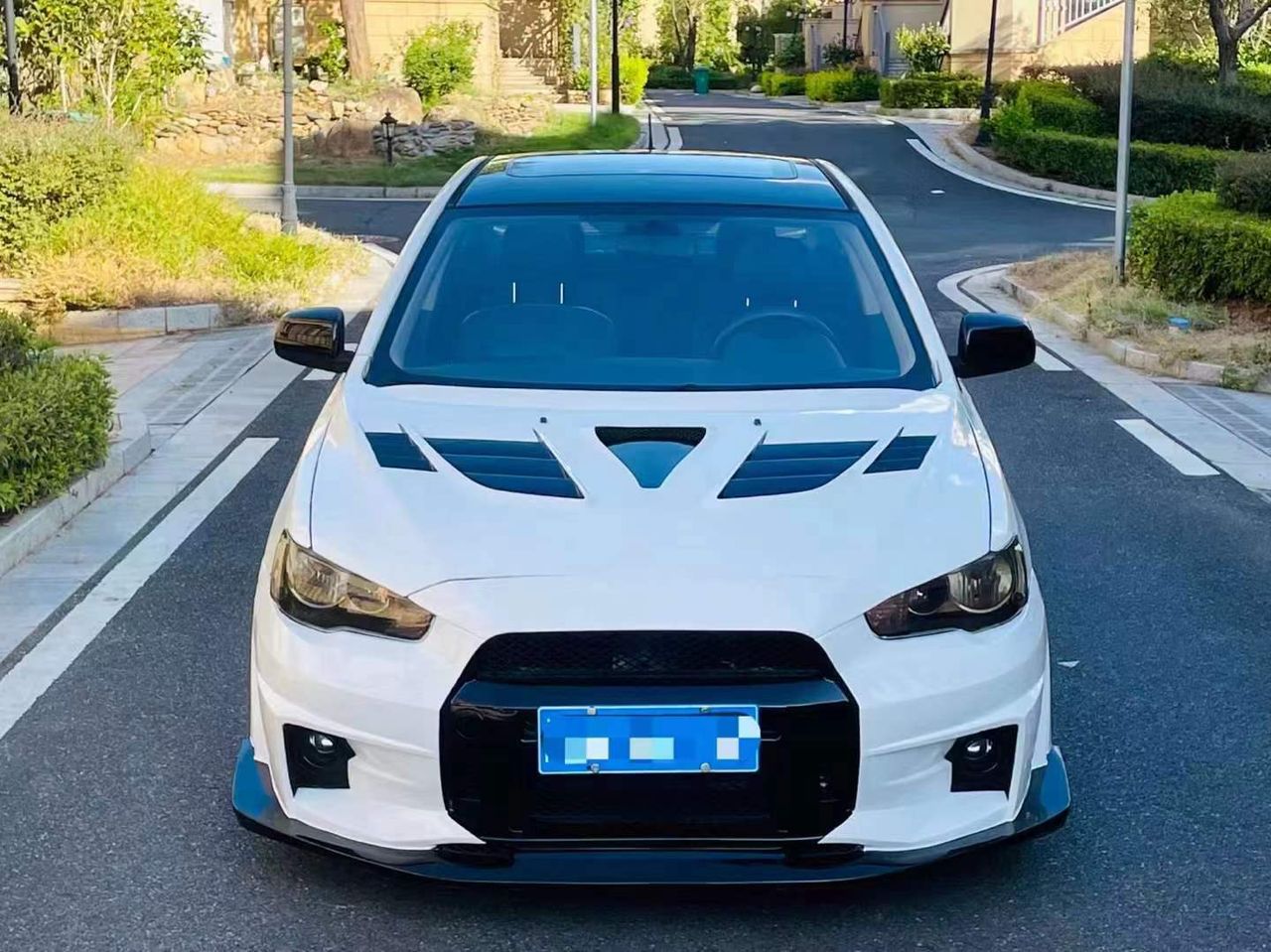 2010–2015 Mitsubishi Lancer Evolution X VARIS V2 Style Front Bumper – Unpainted FRP Material with Aggressive Aero Ducts and Splitter Design