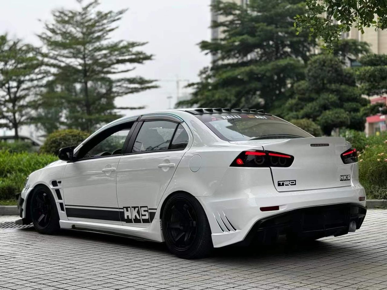 2010-2015 Mitsubishi Lancer Evolution X VARIS V2 Style Rear Bumper – Unpainted FRP Material with Aggressive Diffuser Styling