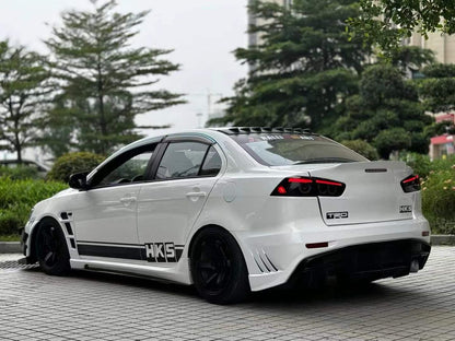 2010-2015 Mitsubishi Lancer Evolution X VARIS V2 Style Rear Bumper – Unpainted FRP Material with Aggressive Diffuser Styling